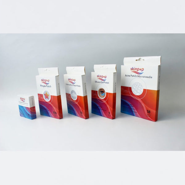 Set of Skinpop branded product packages on a white background